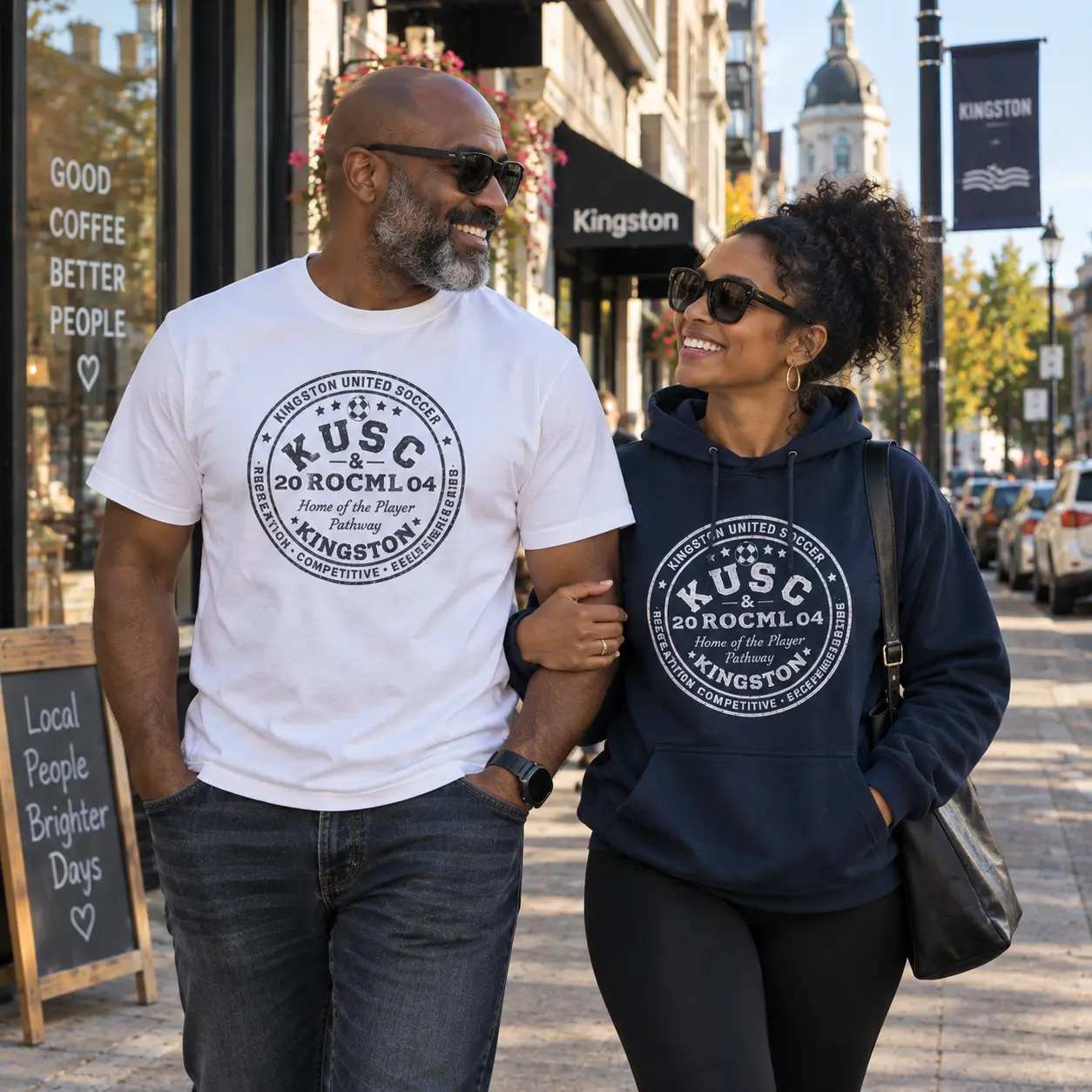 Supporters wearing a white Heavyweight Tee and navy Everyday Hoodie in downtown Kingston
